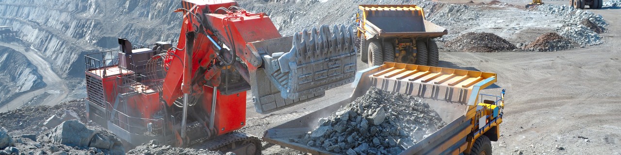 Excavator extracting iron ore