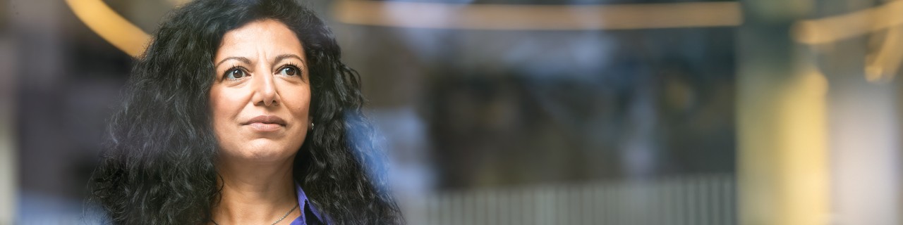 Middle-aged woman gazes into the distance