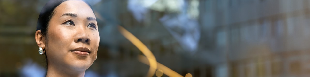 Young woman gazes into the distance