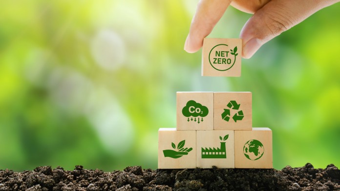 Wooden cubes on top of each other with different sustainability symbols