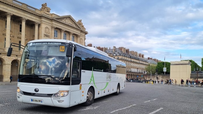 White E-bus in a city