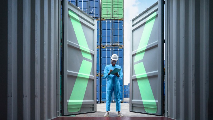 View into an open container, with a worker in front