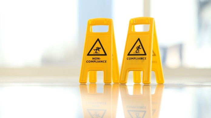 Warnpoller mit der Aufschrift "Compliance" und "Non-Compliance"
